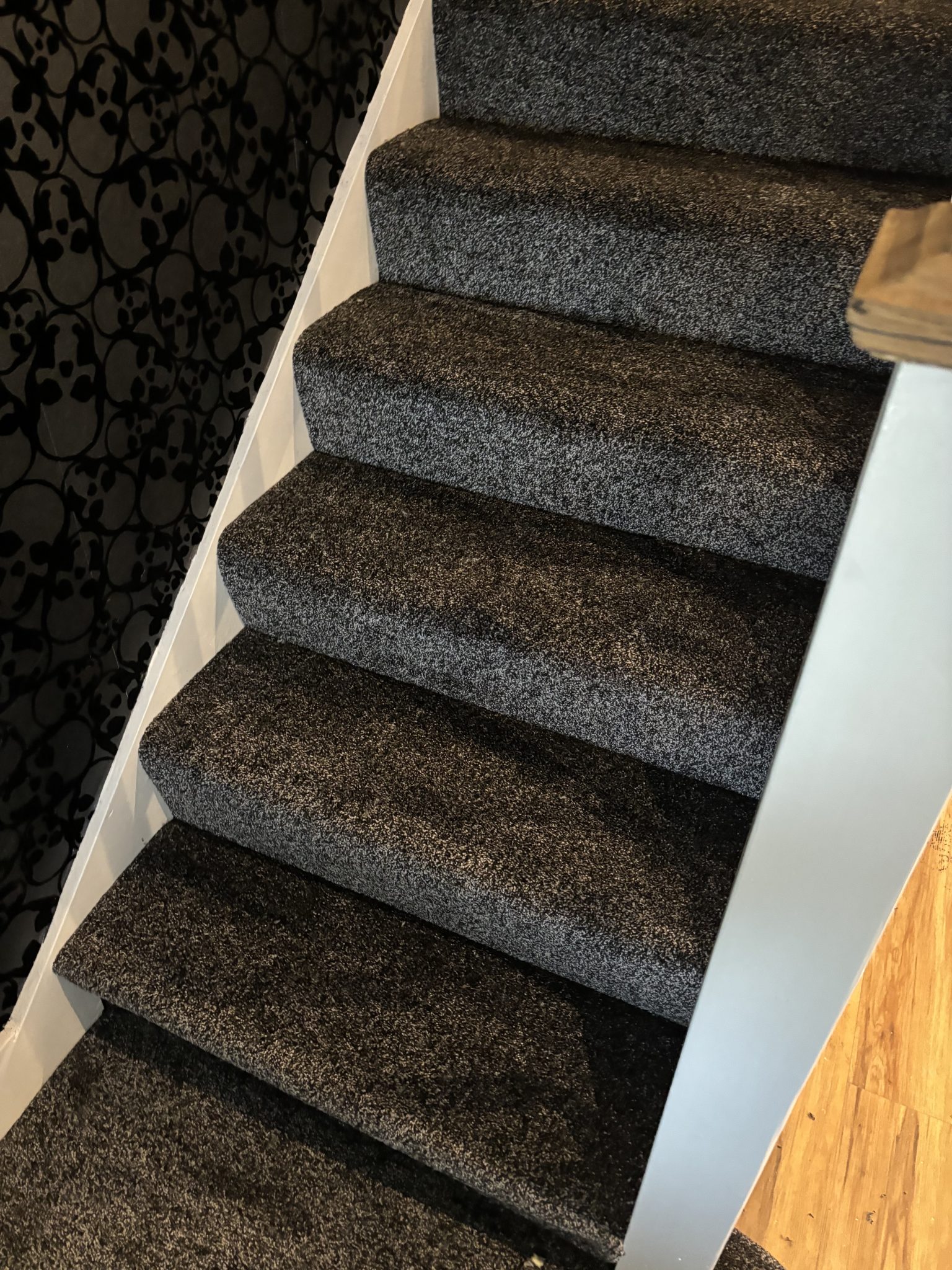 Dark carpet professionally fitted to staircase by Strictly Floors