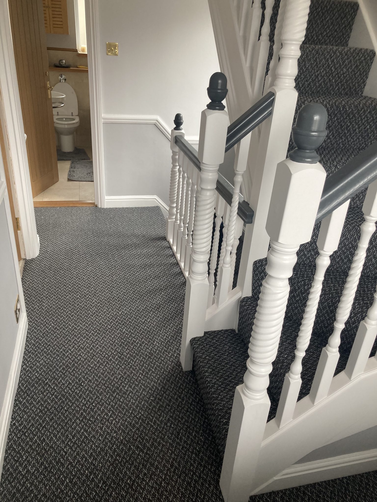 Patterned carpet professionally fitted to stairs and landing by Strictly Floors