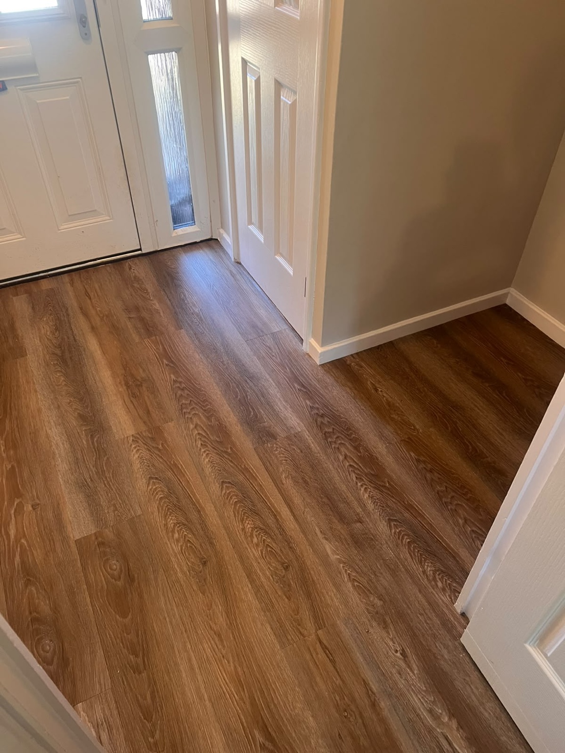 Brown LVT flooring professionally fitted by Strictly Floors